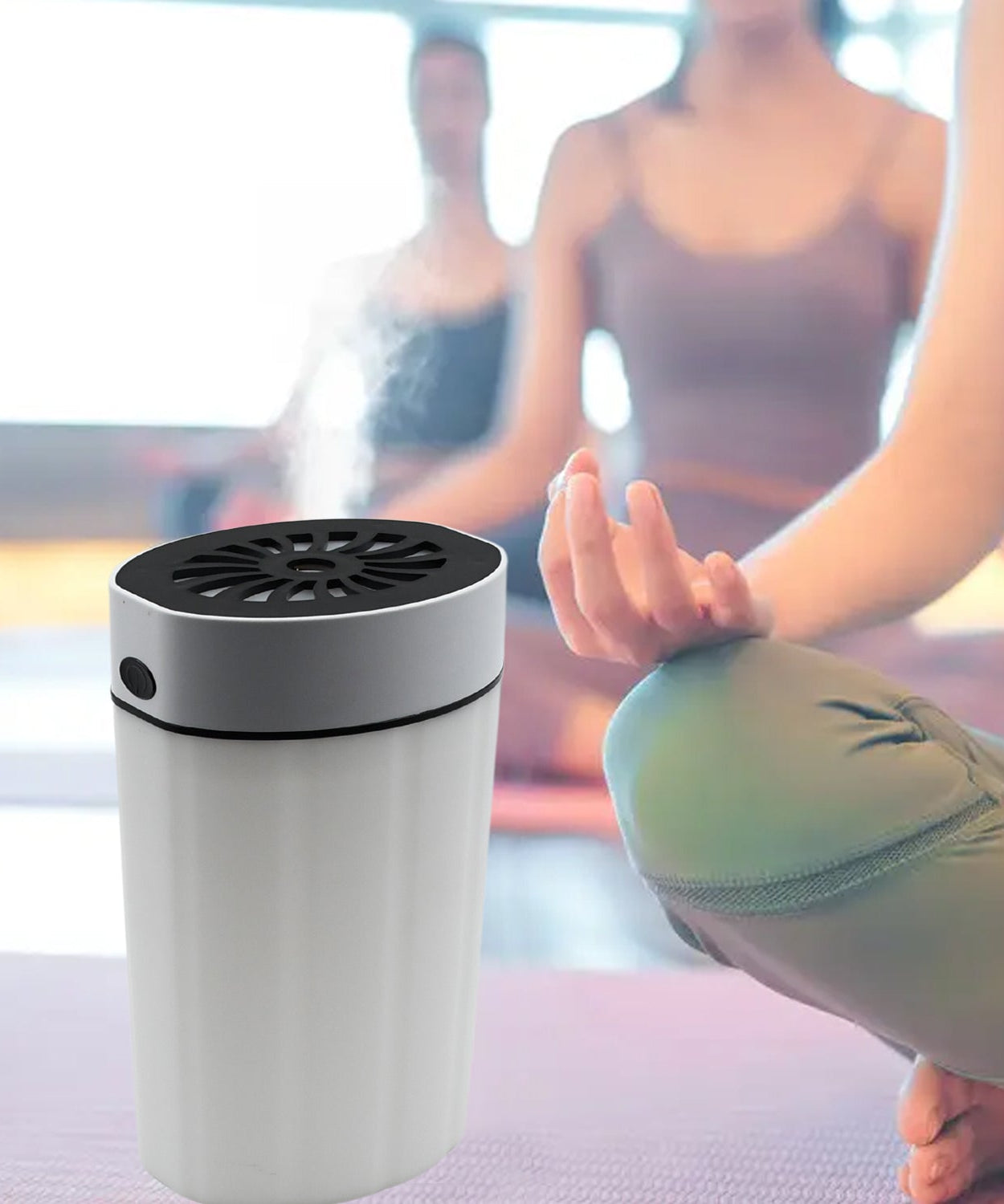 Compact humidifier with colorful lighting, suitable for desk or bedroom use.