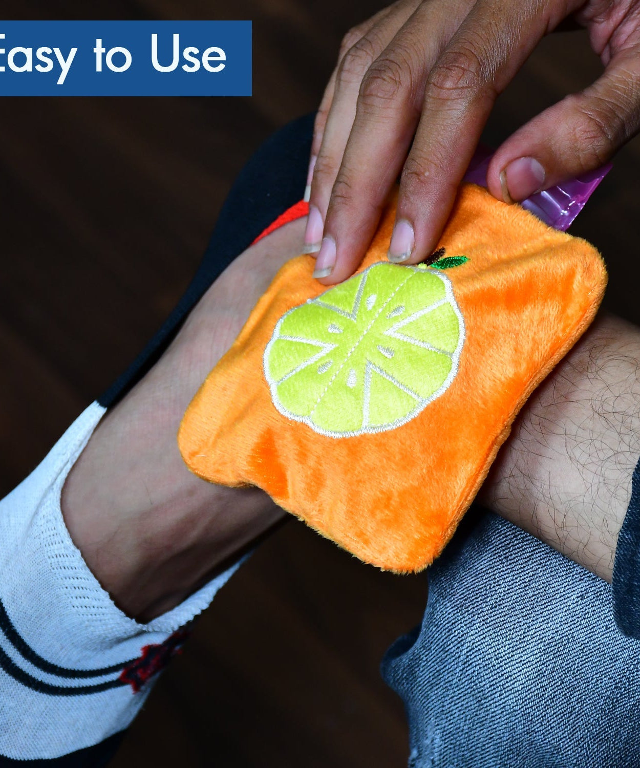 Orange hot water bag for menstrual cramps and body warmth