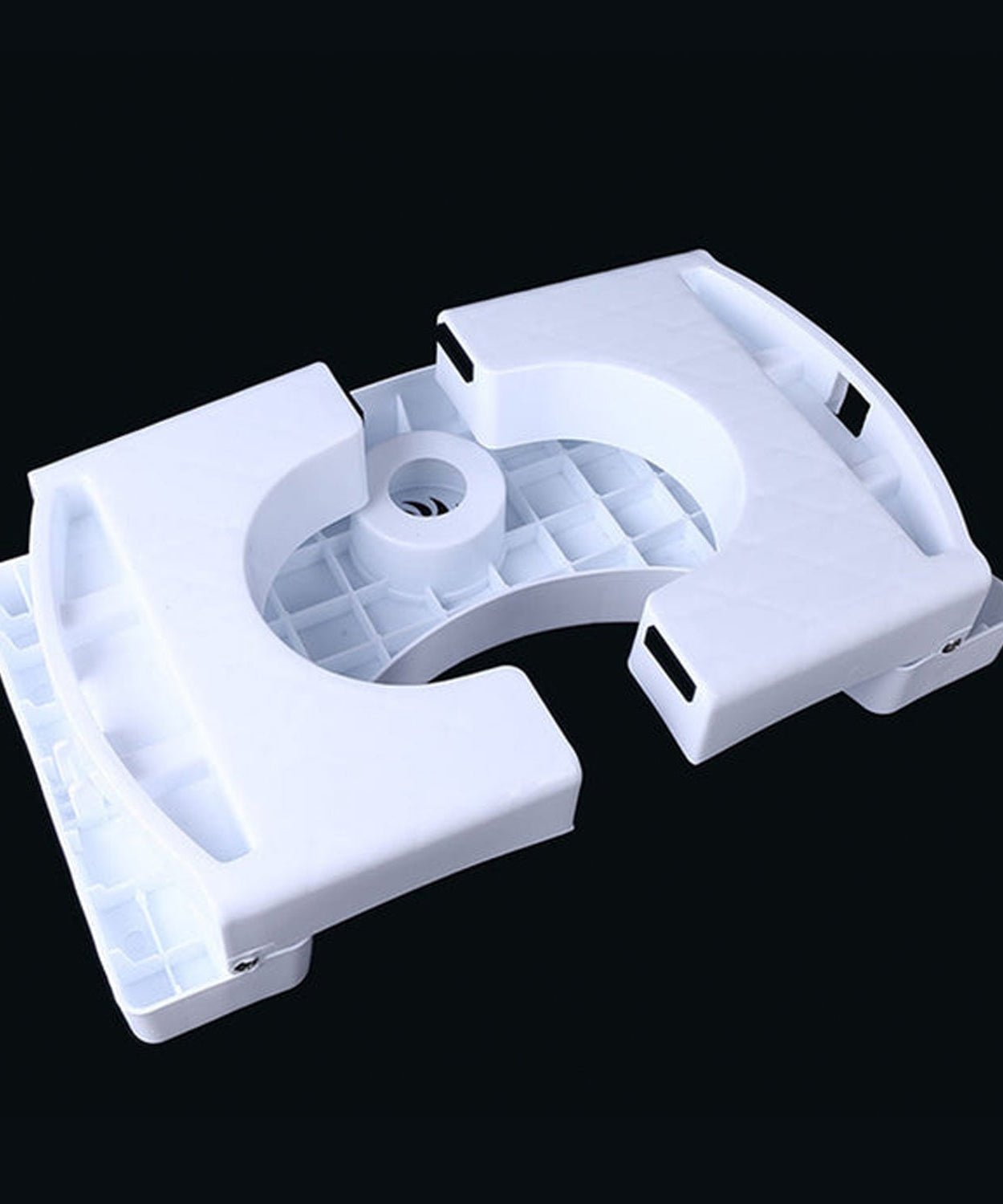 White plastic folding squat stool with anti-slip features.