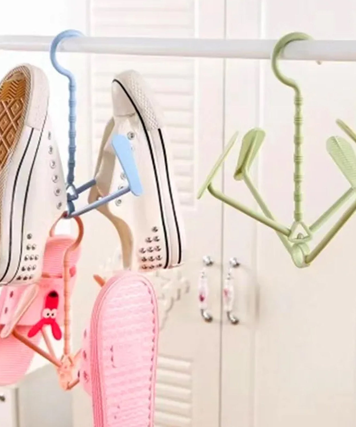 Rotating shoe rack with four hooks, portable, dual-use for wet and dry shoes.