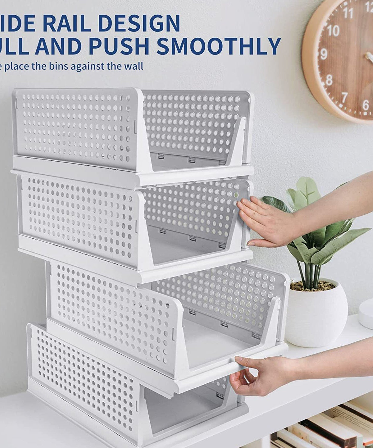 Clothes organizer with four plastic drawers, foldable and stackable for efficient storage.