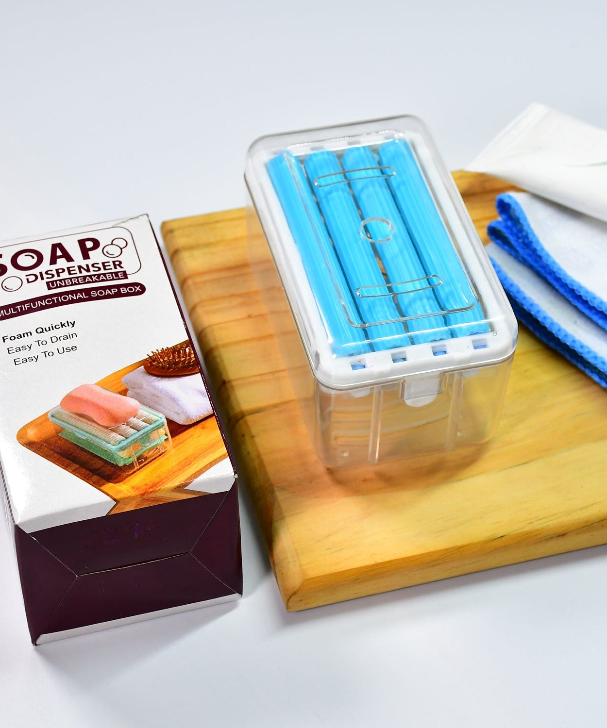 Portable soap dish with roller and drainage for effective soap management