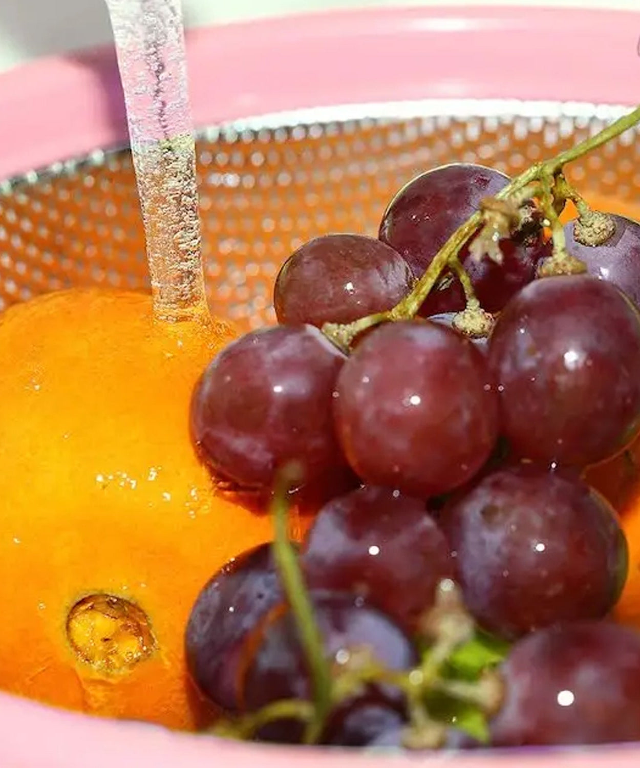 Colander being used for washing berries