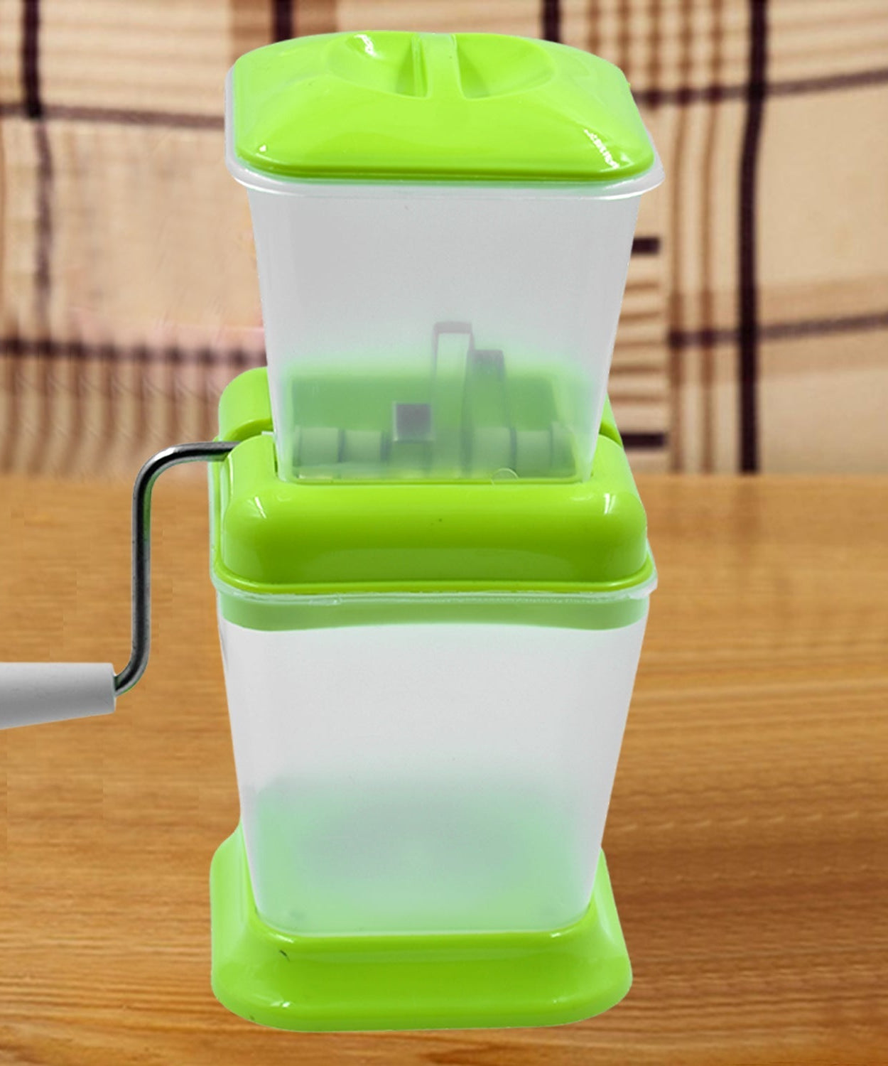 Small onion and vegetable chopper with rotating blade for fast cutting.