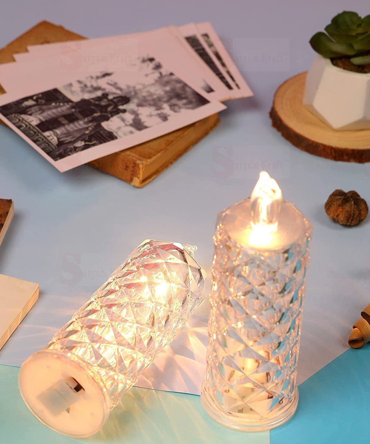 Flameless rose candle with an elegant transparent acrylic base, perfect for festive decorations.