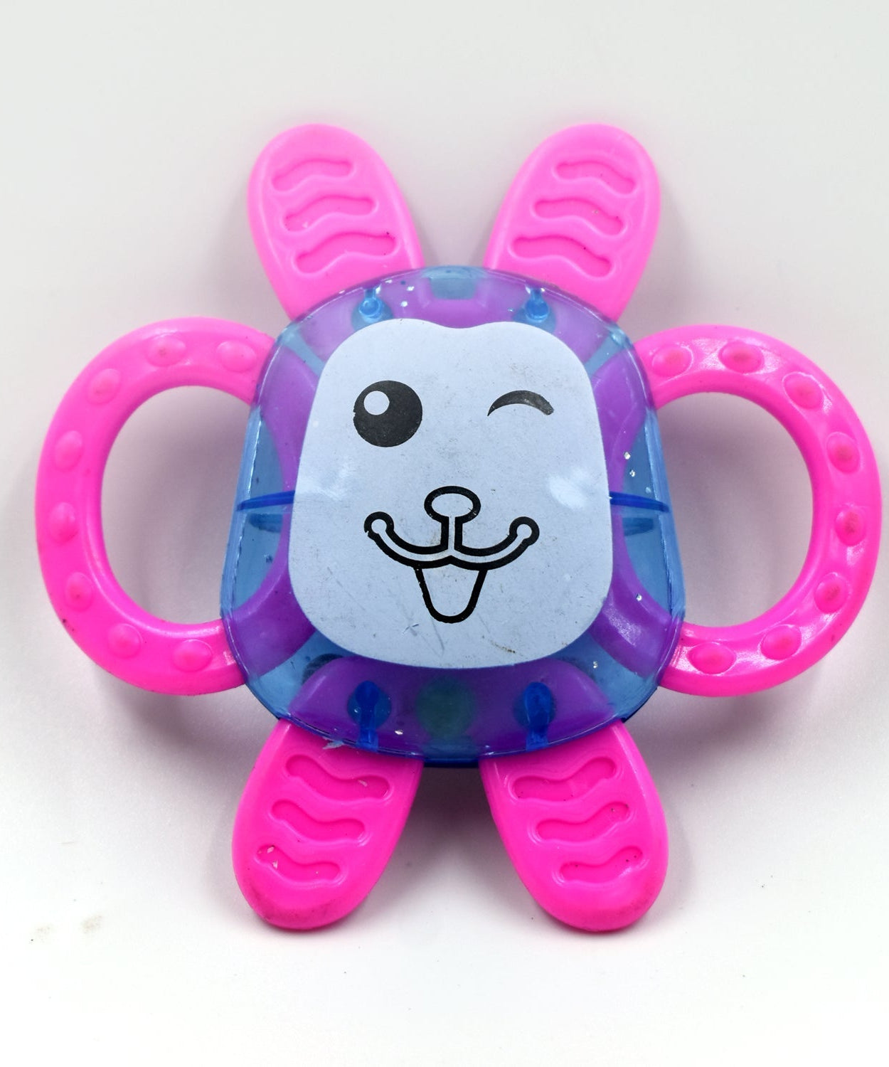 a set of three baby rattles featuring various colors and patterns.