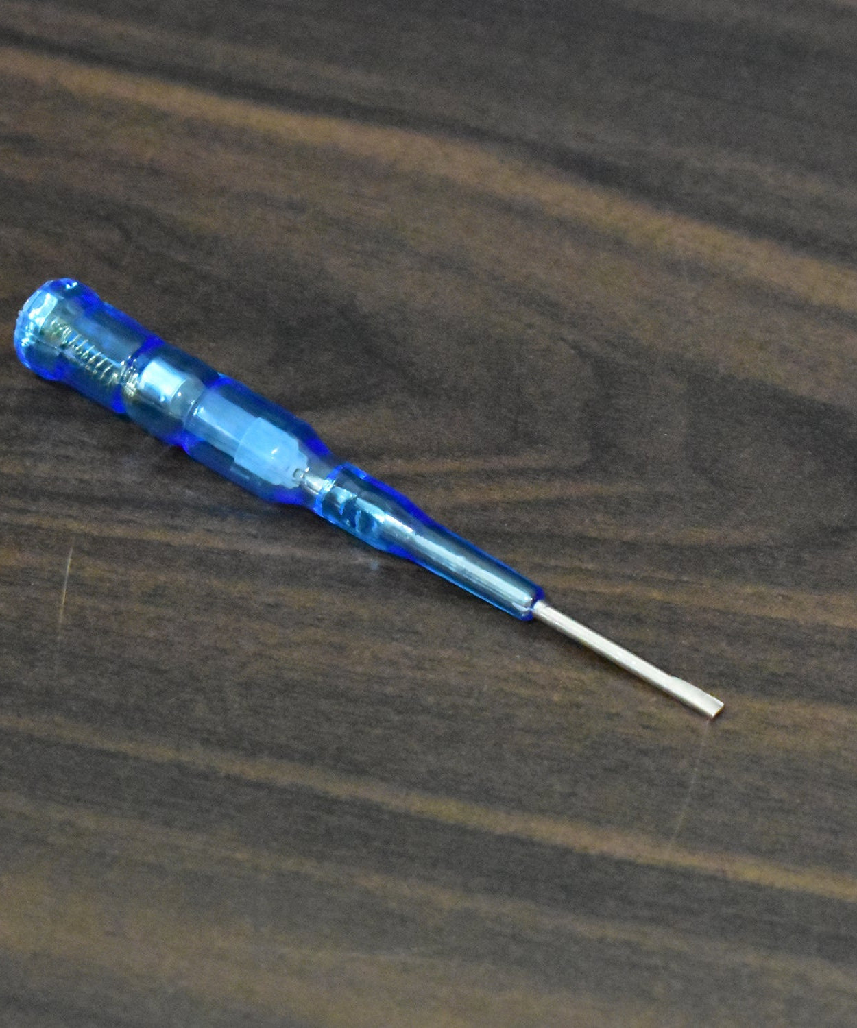 Metal screwdriver with built-in tester for electrical applications.