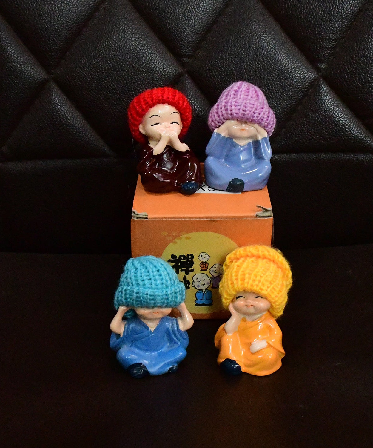 Decorative Resin Monk Buddha Showpiece Set of 4 with Traditional Straw Hats