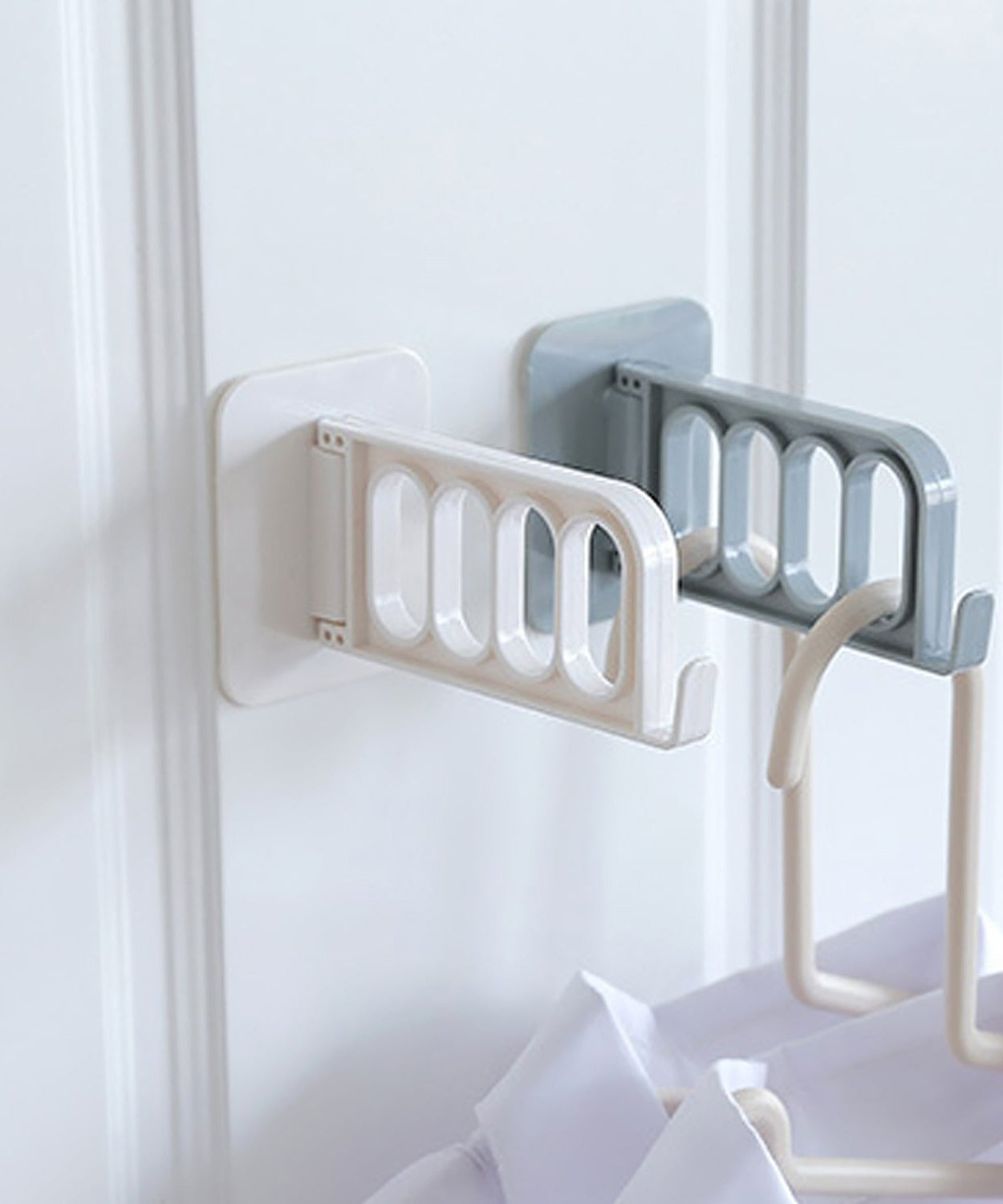 Simple door hook for various uses in bathroom, kitchen, or bedroom.