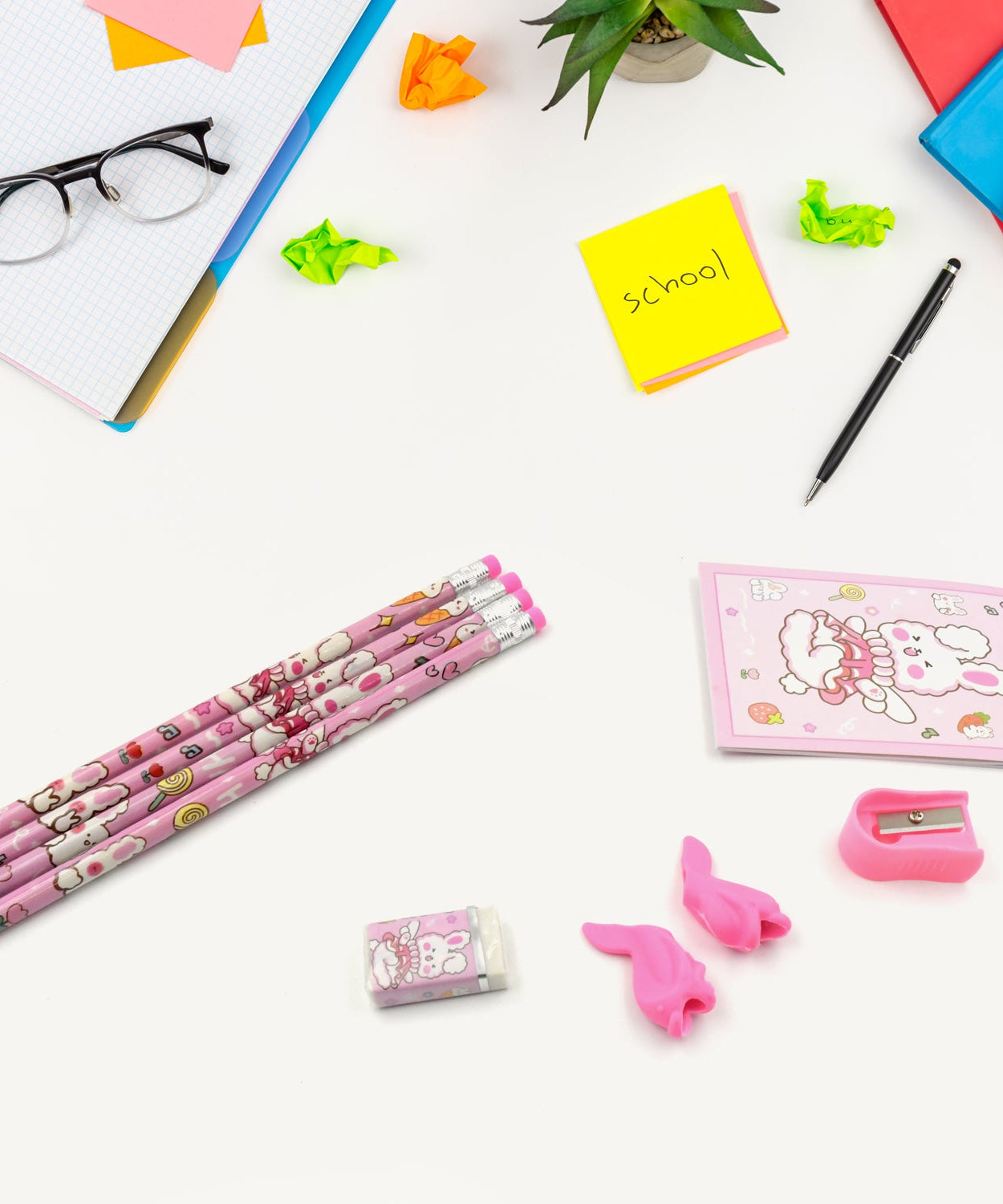 Kids' stationery kit with wooden pencils and sharpener.