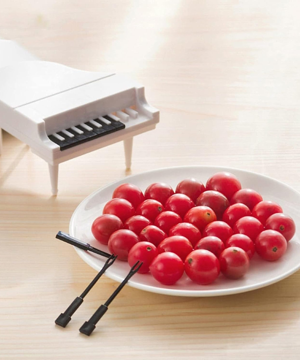 Cute piano-style fruit forks for fun snacking.
