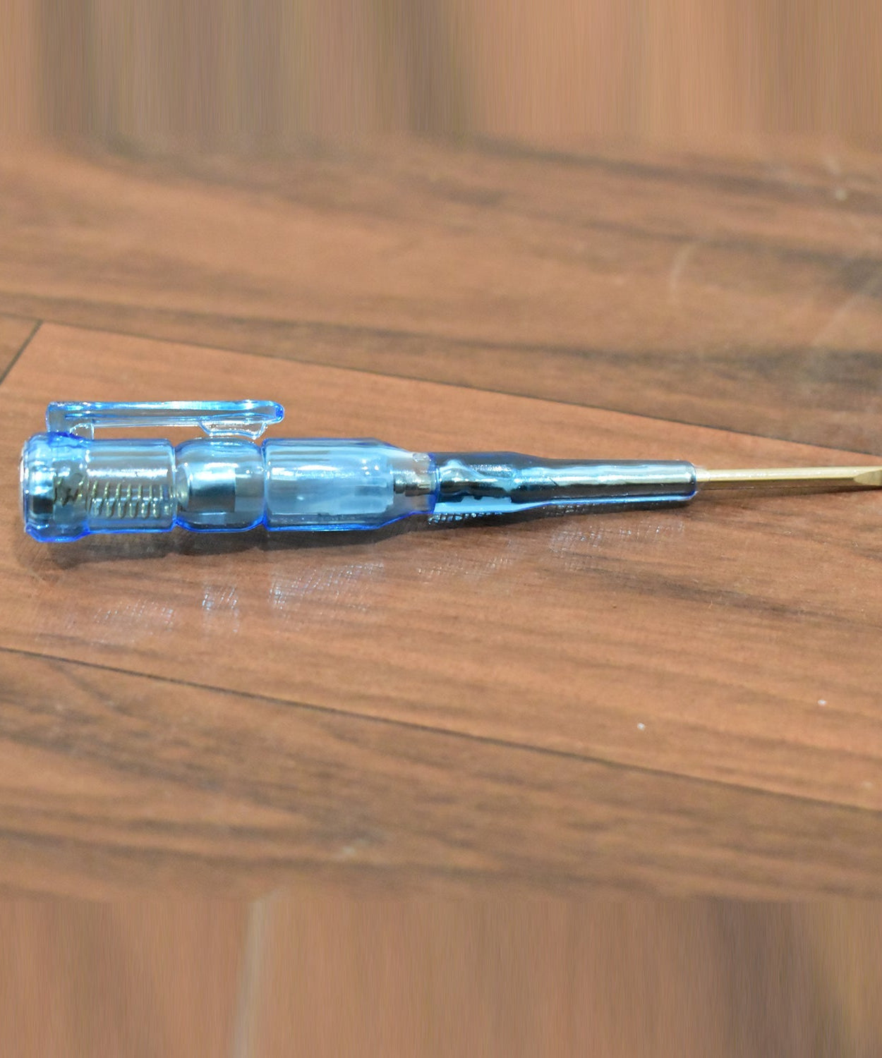 Linemen screwdriver with metal tester for electrical repairs.