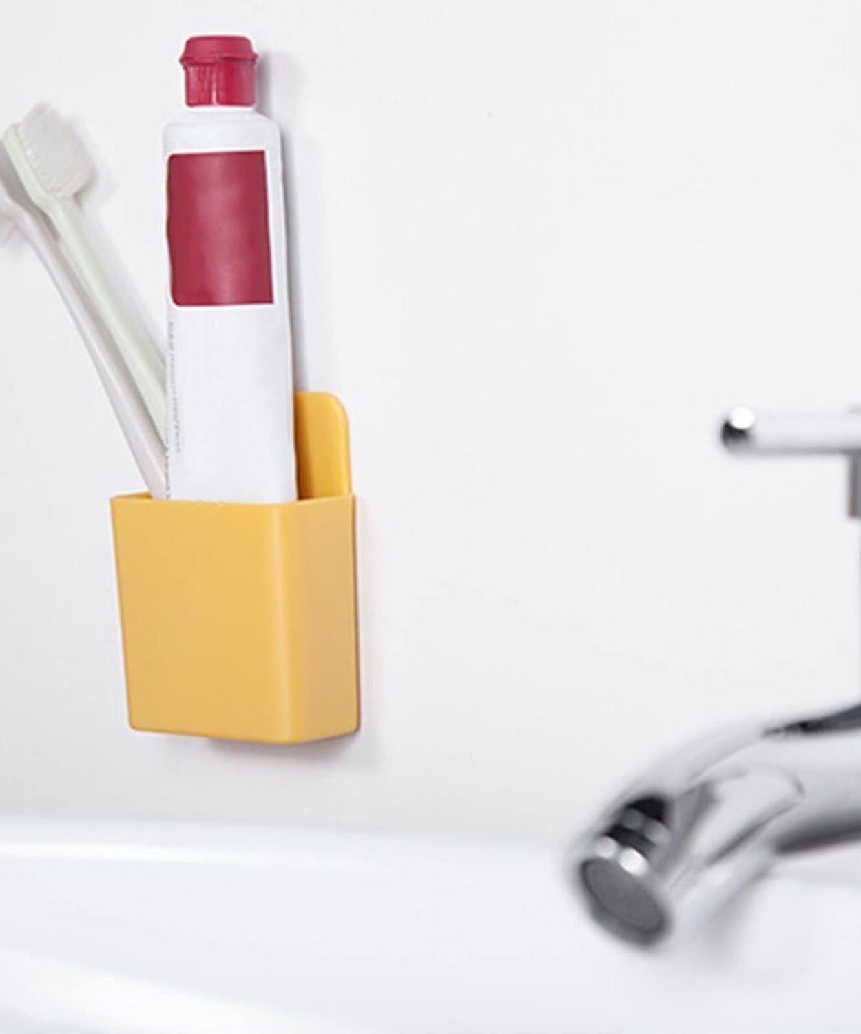 Plastic stand for organizing remotes and phones, wall-mounted