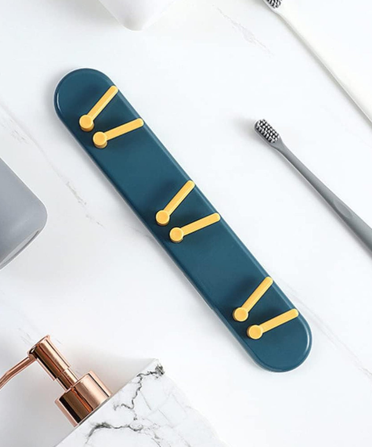 Wall-mounted toothbrush holder with shelves and hooks for bathroom organization.