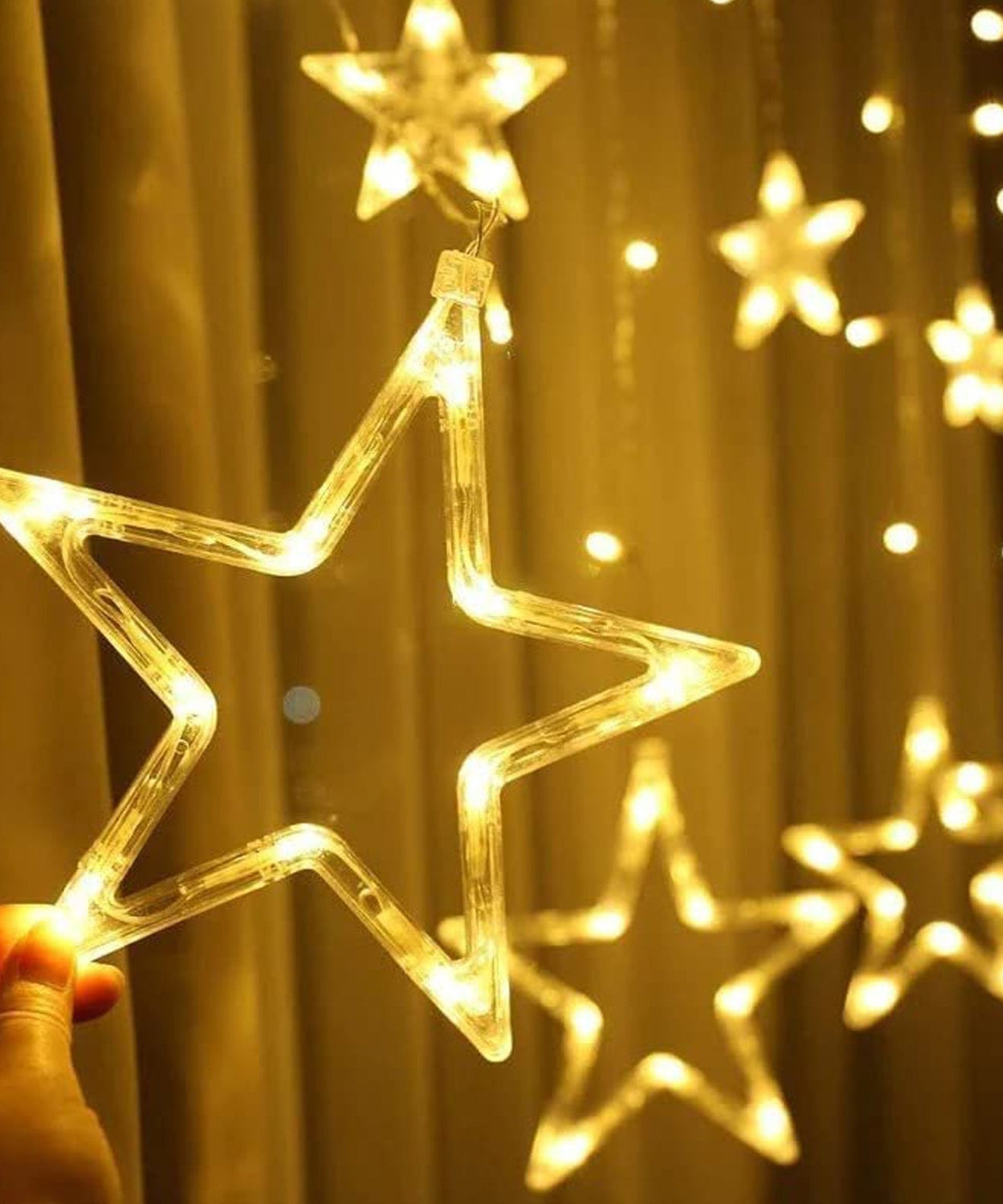 Festive window lights with flashing star designs