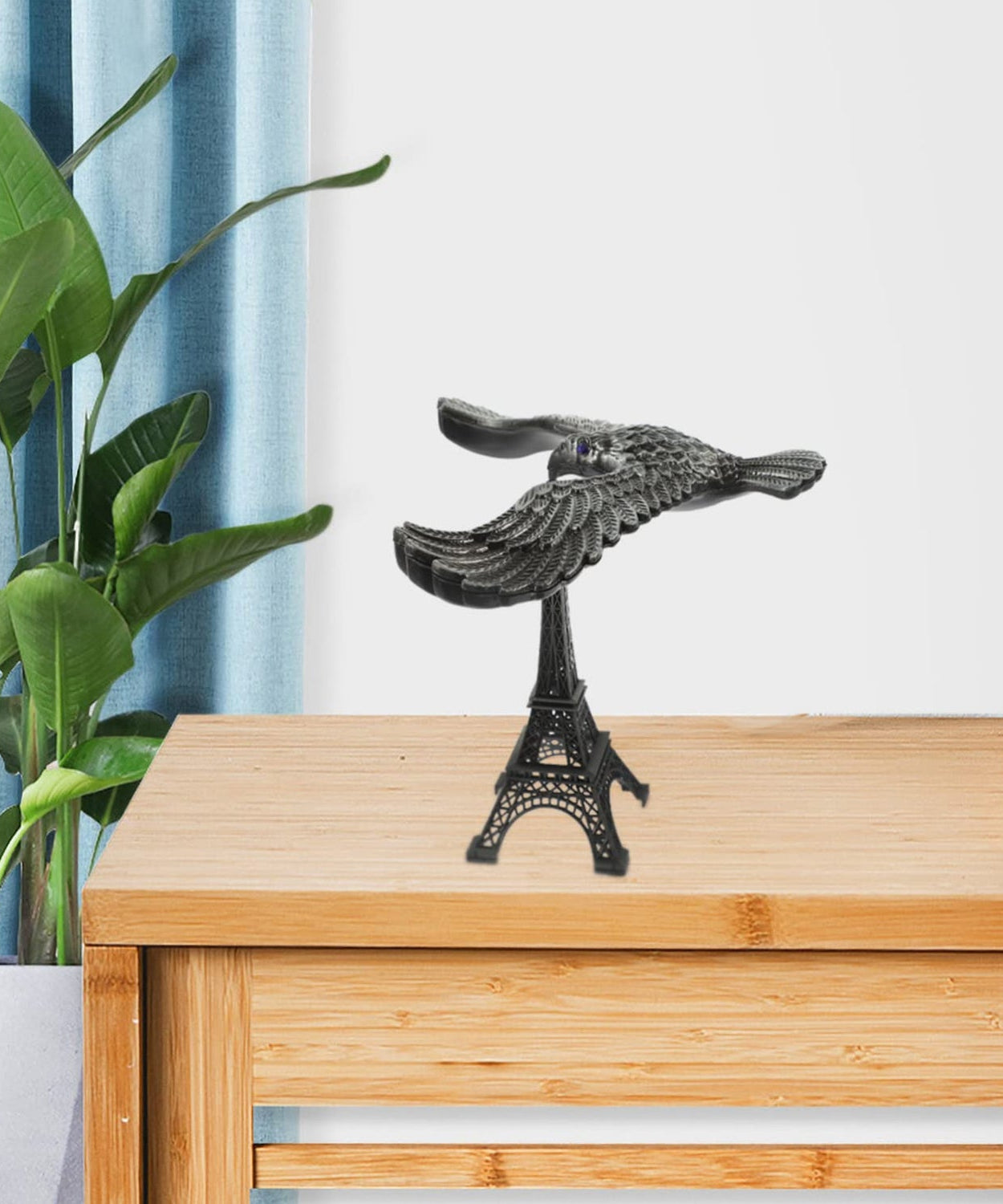 Balancing Bird on Eiffel Tower Base