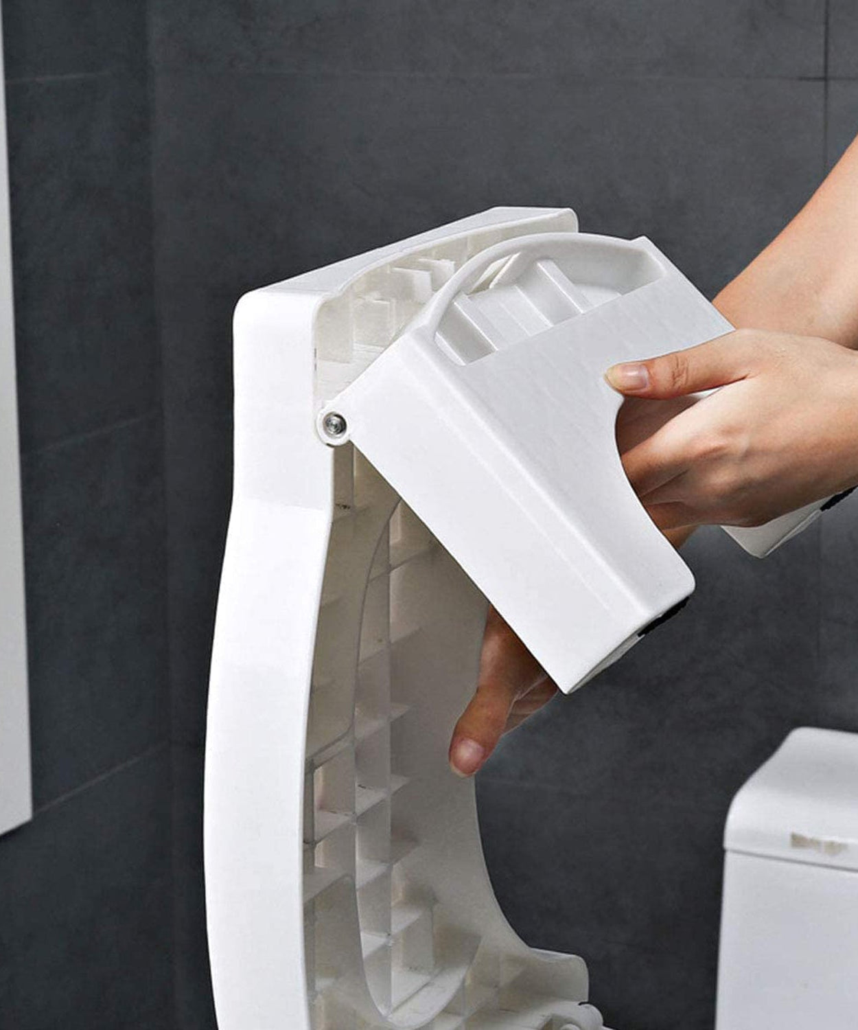 Non-slip, foldable white squat stool for improved toilet comfort.