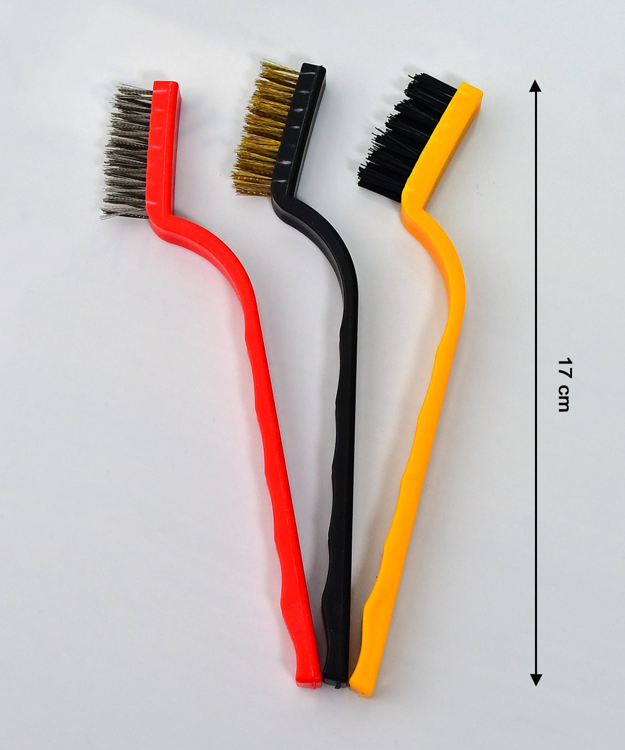 Multi-material wire brushes for cleaning hard-to-reach areas