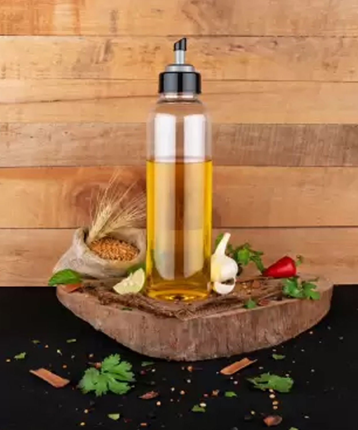 Close-up of the spout and lid on a clear plastic oil dispenser for precise pouring.