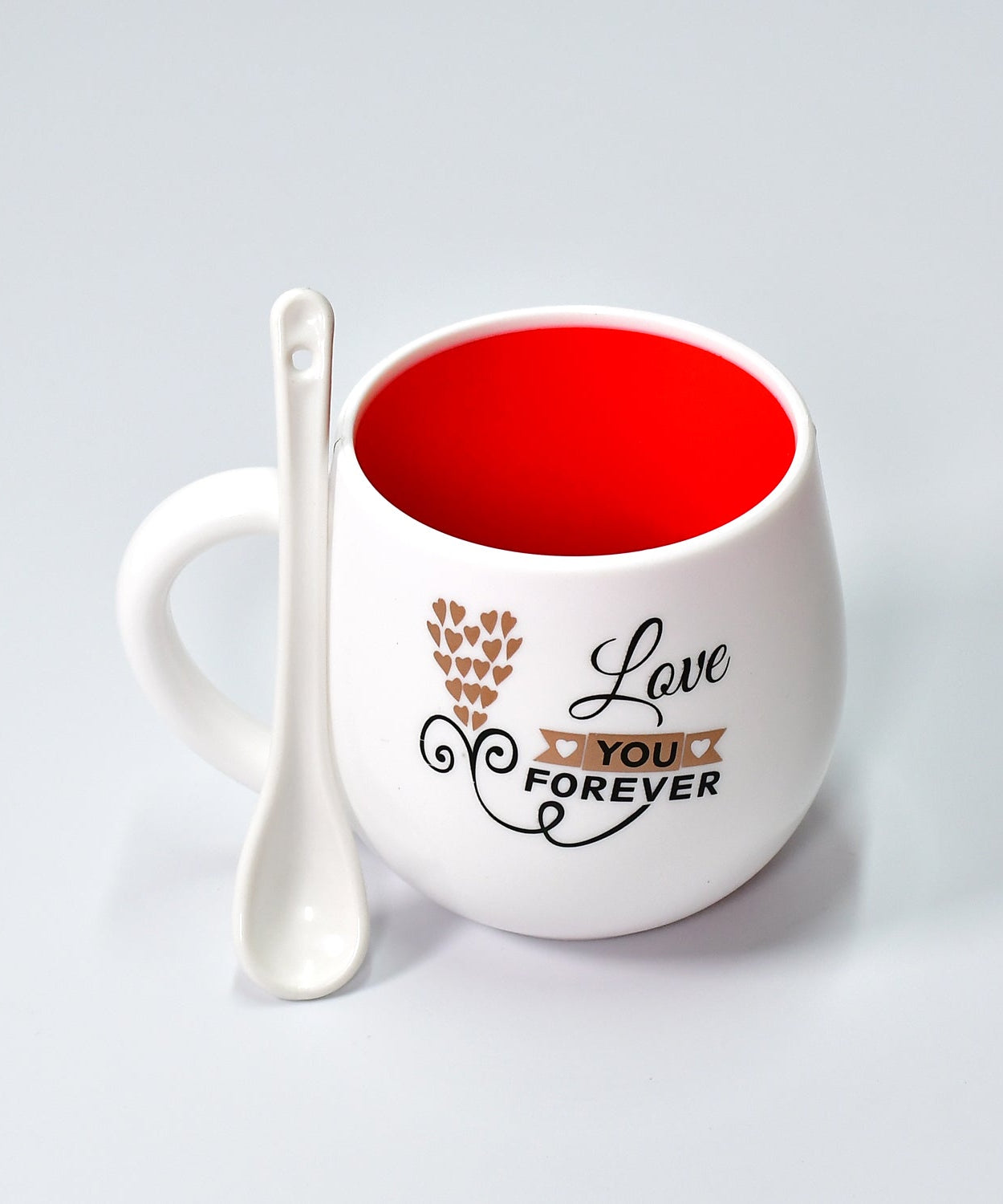 Ceramic coffee mug with matching spoon, perfect for gifting