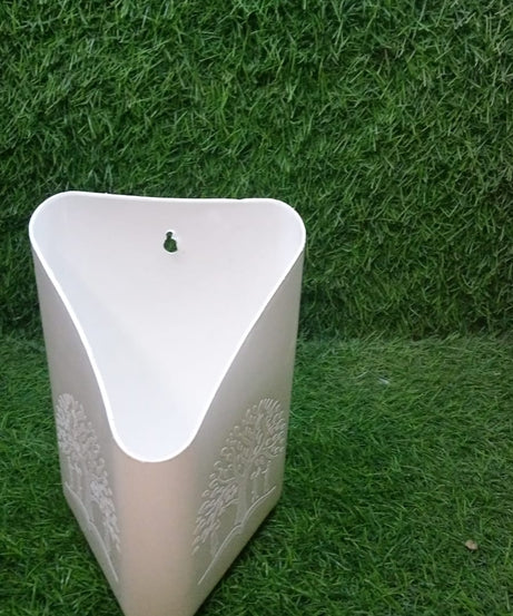 Bright multi-colored hanging planter for plants.