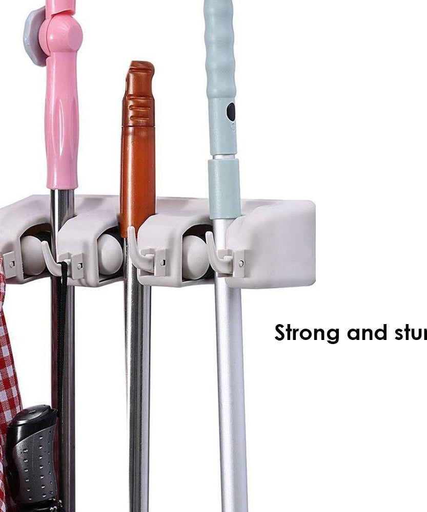 Space-saving mop and broom holder.