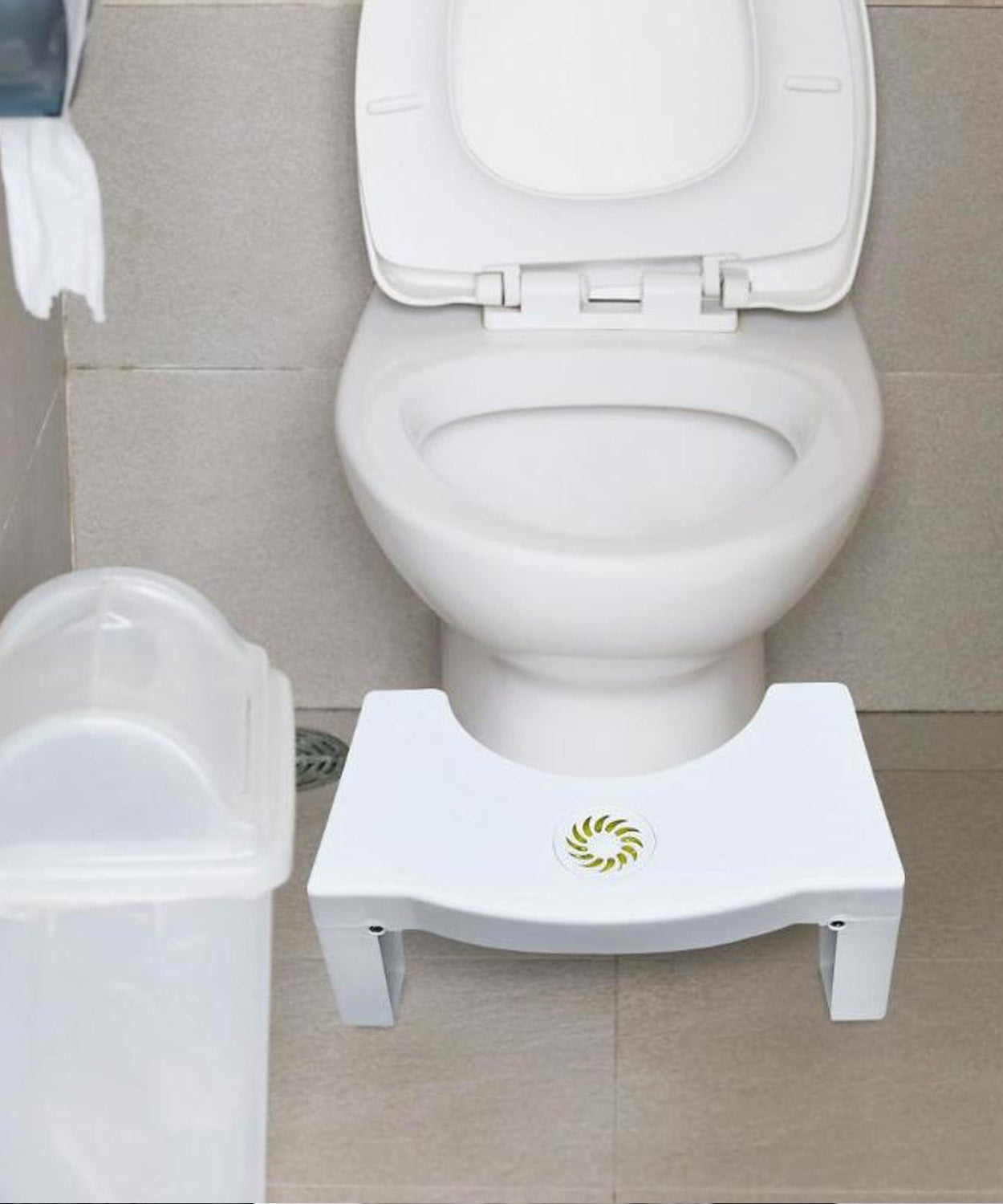 White toilet squat stool, easy to fold and non-slip for safe use.