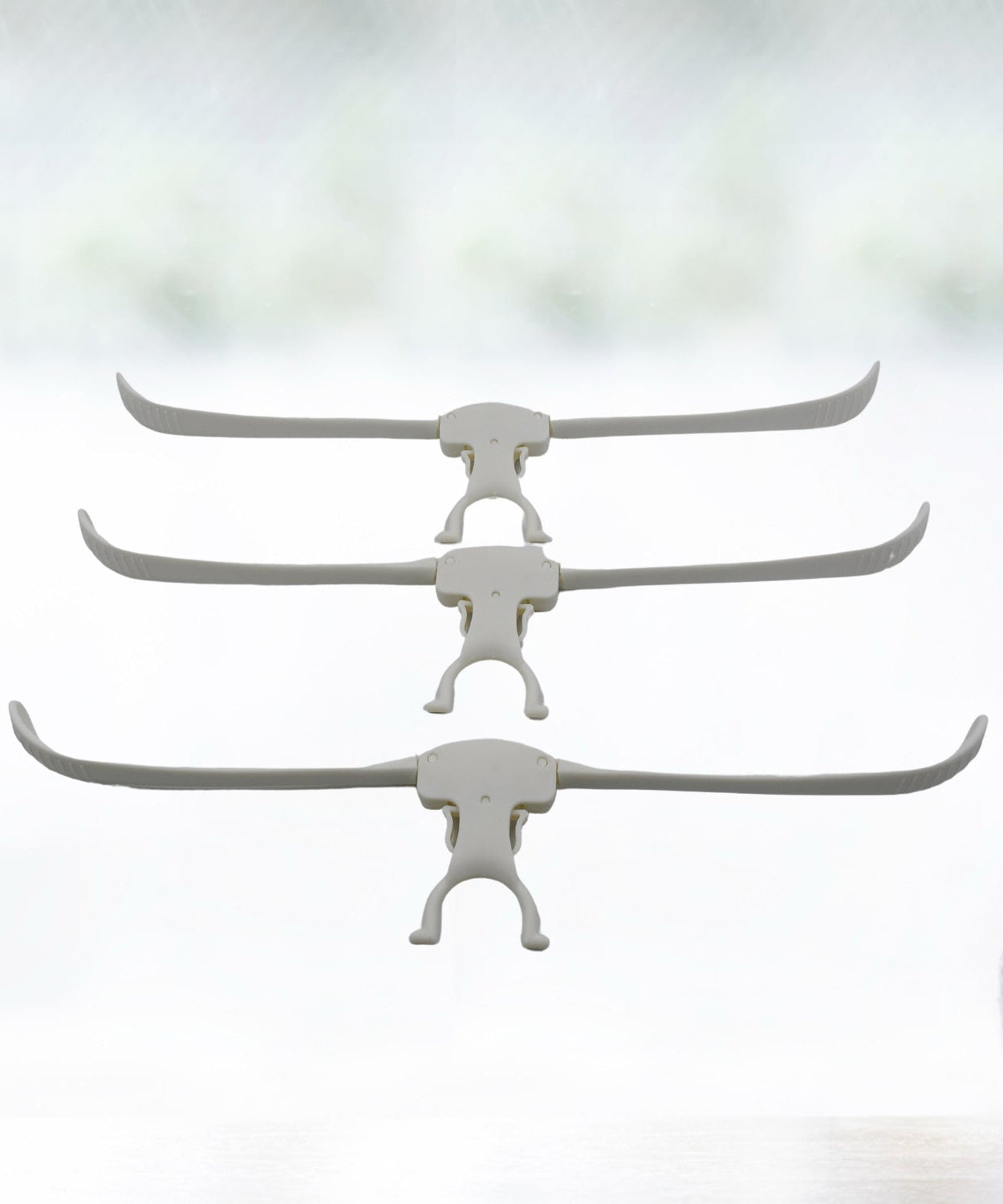 Multi-layer stainless steel hanger for trousers, scarves, and belts, space-saving design.