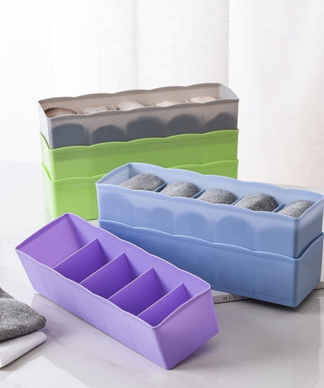 Multi-colored bead storage tray with dividers, ideal for organizing small items.