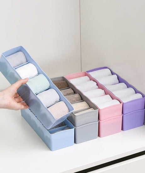 Plastic organizer with dividers, perfect for sorting beads and other small items.