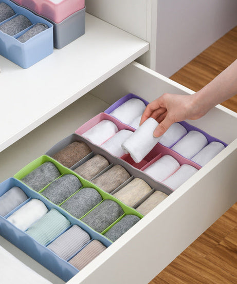 Clear plastic bead storage tray with multiple compartments for easy organization.