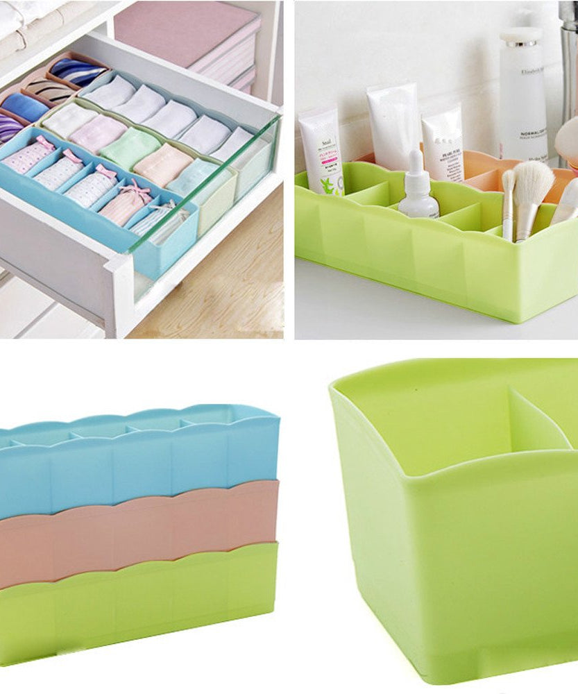 Multi-colored tray with clear plastic and dividers for organizing small beads.