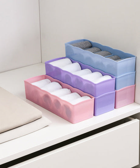 Organizer tray with clear plastic and several compartments for bead storage.