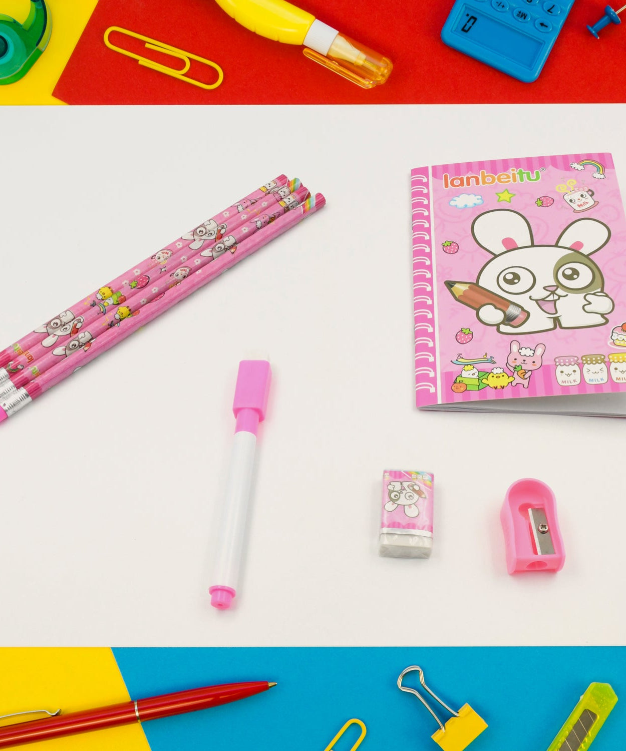 Kids' stationery kit with wooden pencils, sharpener, and eraser.