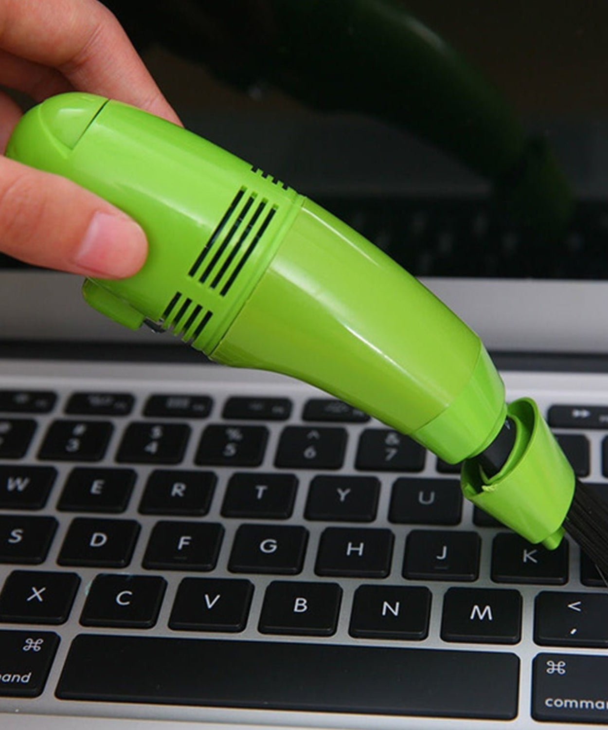 Lightweight USB mini vacuum for precise cleaning of small areas and gadgets.