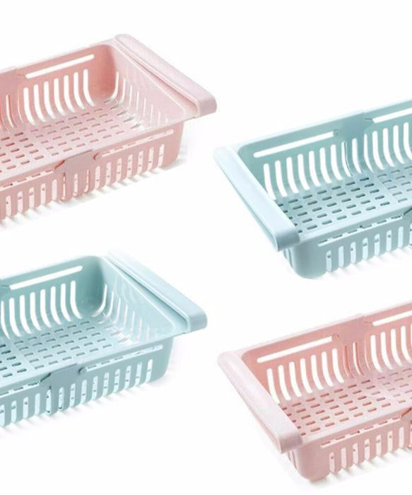 Fridge organizer baskets for efficient food storage.