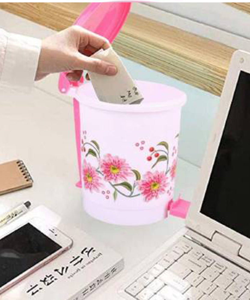 Small plastic pedal dustbin for home or office, easy hands-free use.