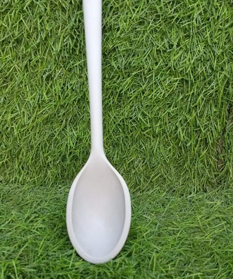 Heat resistant large silicone spoon, 32 cm, for use in the kitchen.