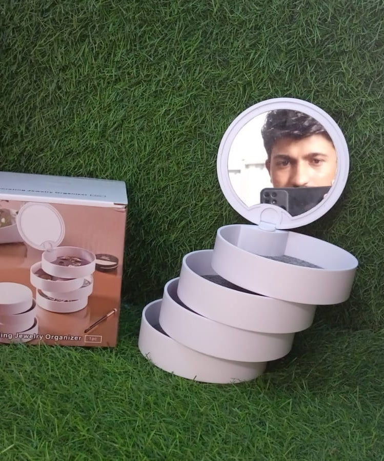 Rotating jewelry box with mirror, four layers for organized accessory storage.