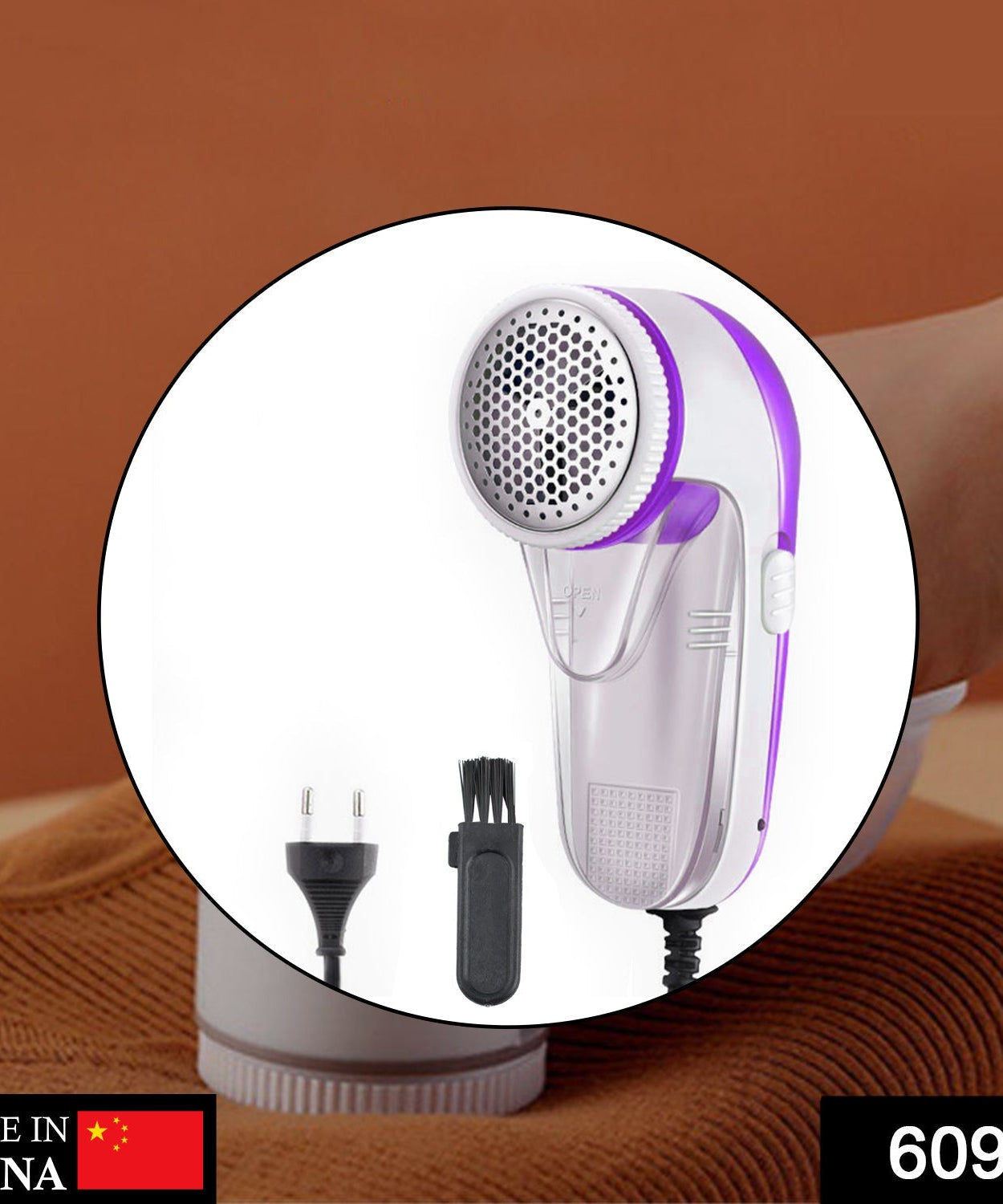 the lint remover, emphasizing its blade and ergonomic handle