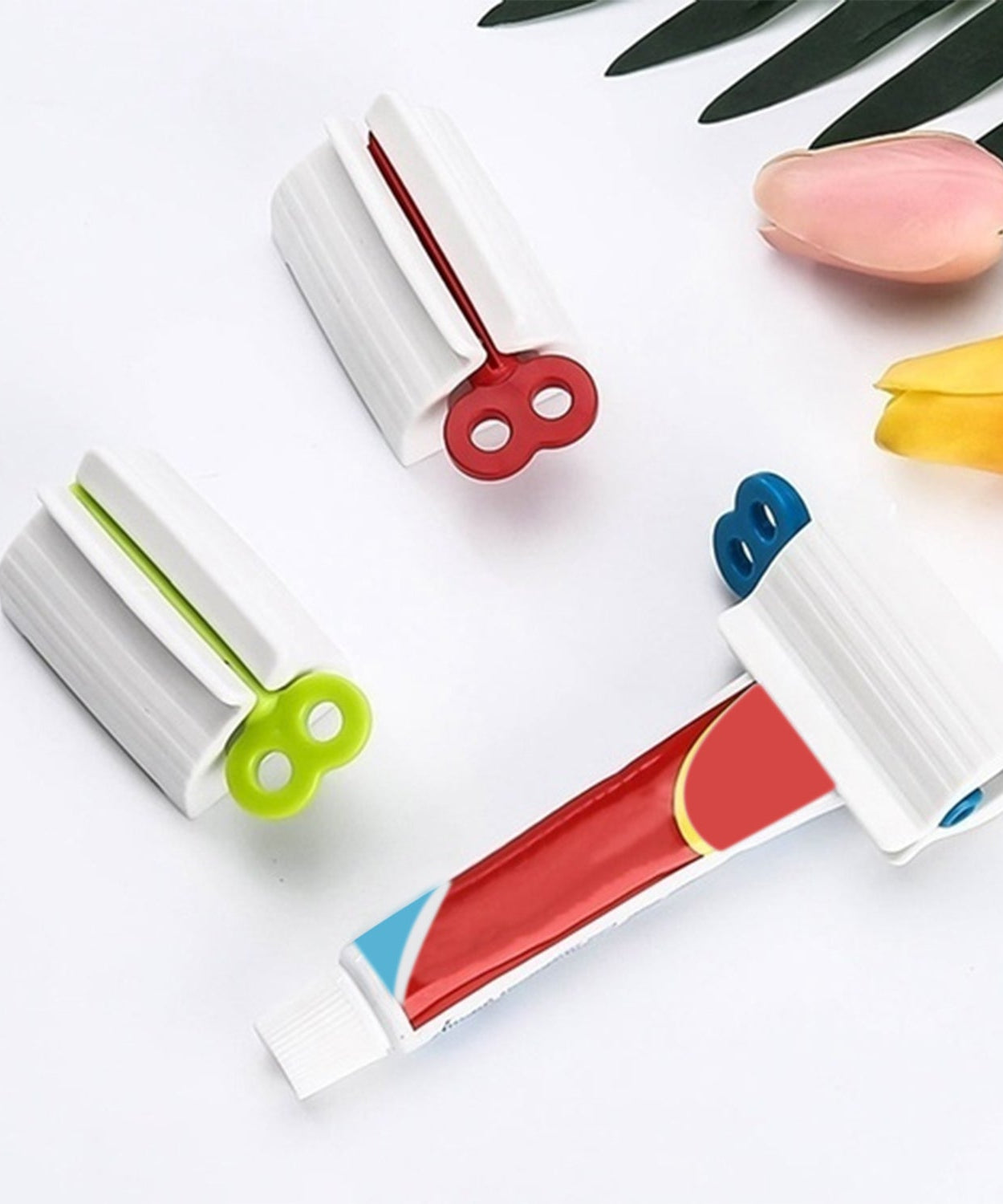 Toothpaste squeezer and holder stand for rolling tubes