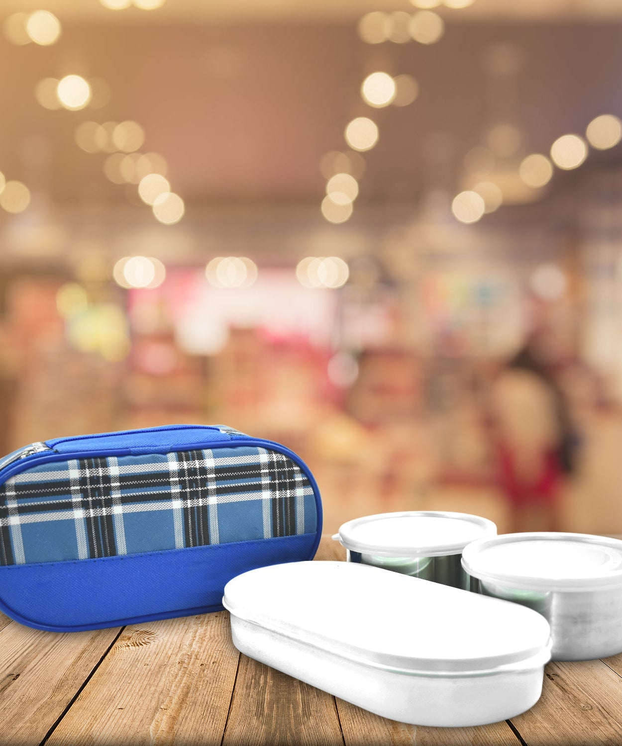 Stacked stainless steel lunch containers for office use