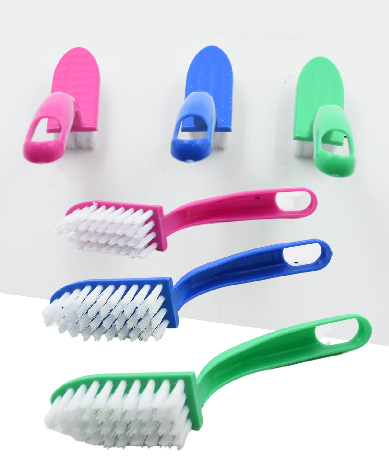Multi-use cleaning brushes for kitchen tasks, including fish and vegetable cleaning.