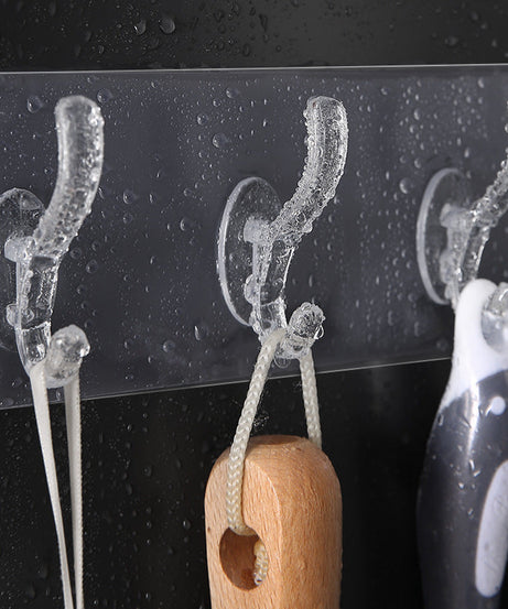 Transparent adhesive wall hook mounted on a surface