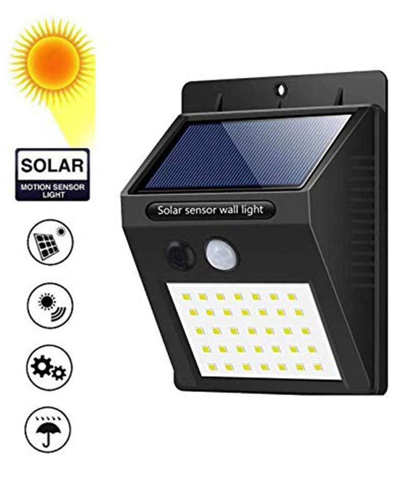Black solar LED night light for home security.