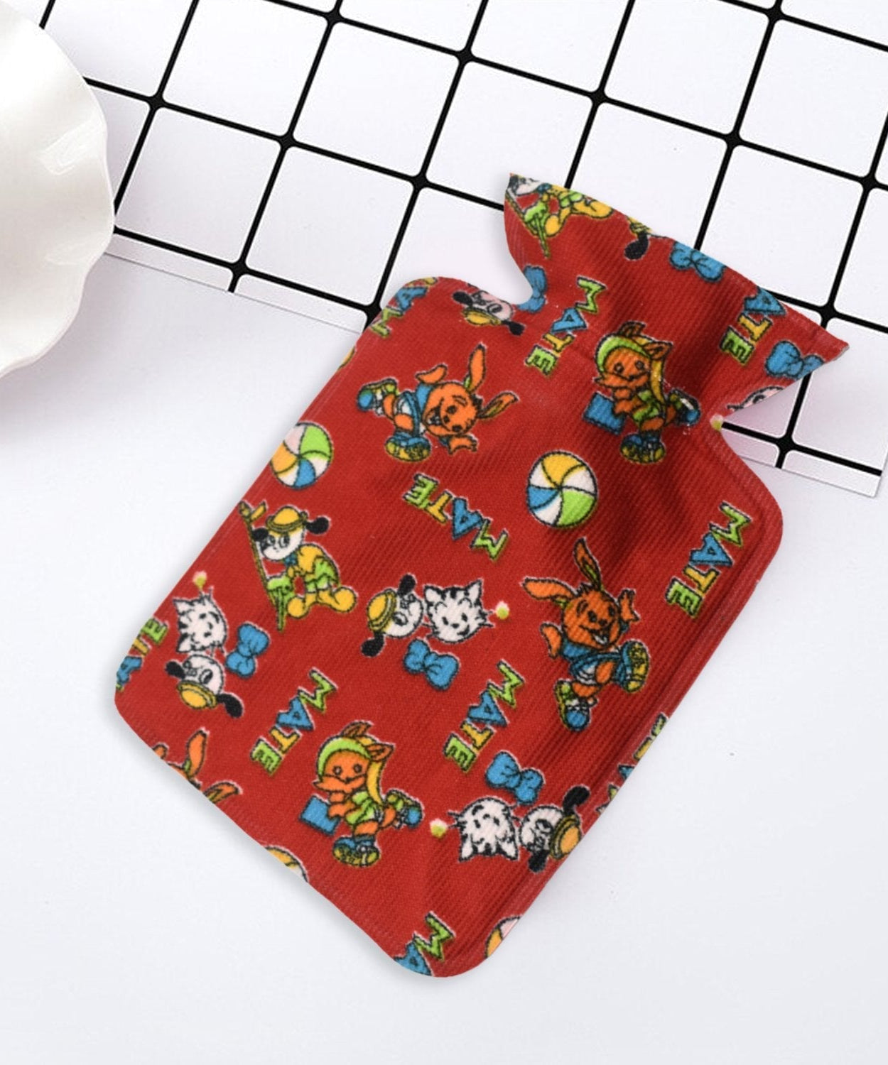 Small rubber hot water heating pad for pain relief.