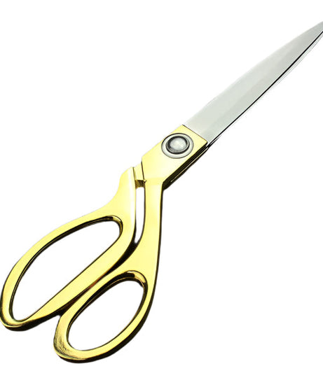 Gold-plated professional scissors for cutting cloth.