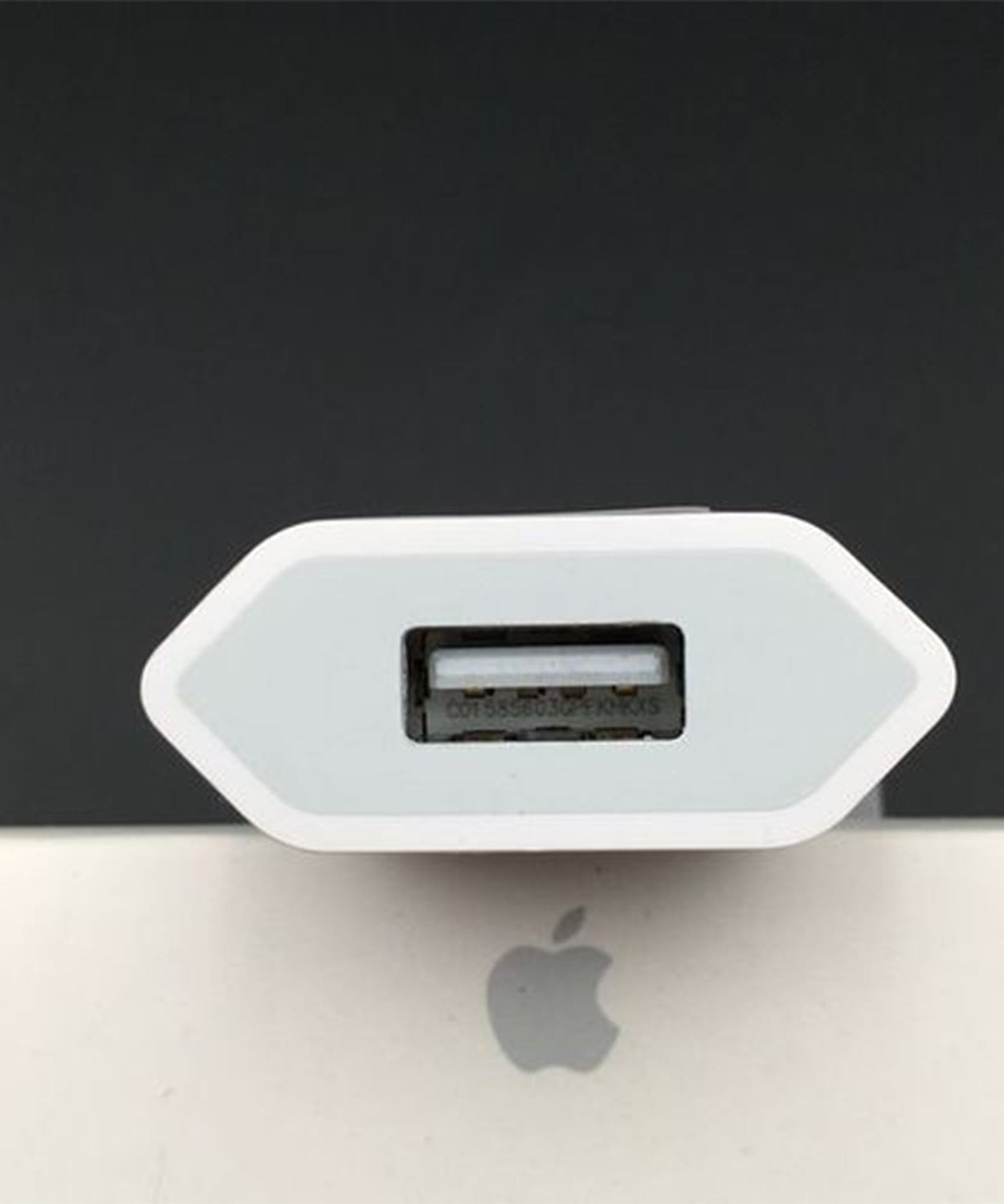 USB wall charger adaptor for iPhone and Android devices, highlighting its compact design