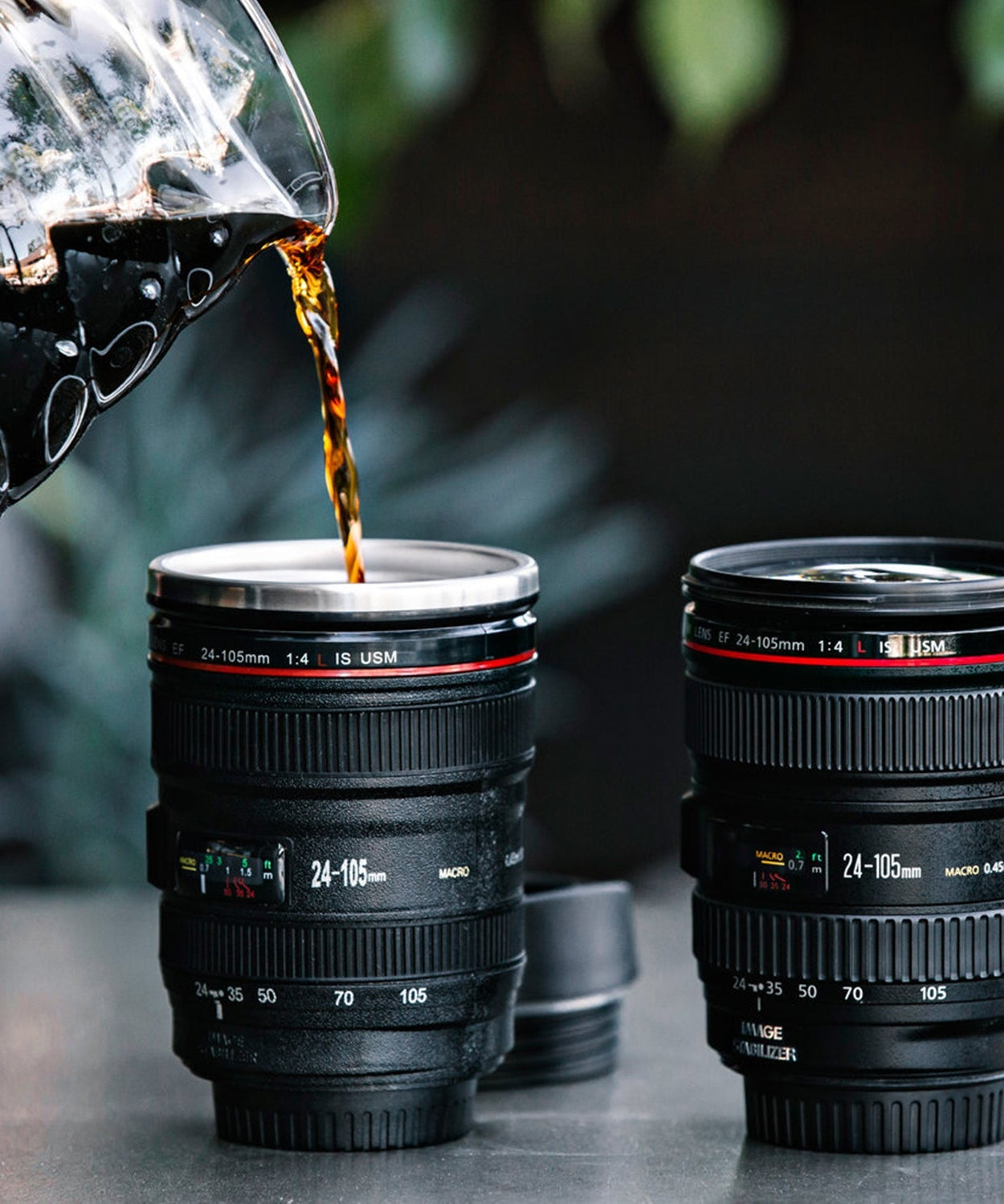 Coffee mug designed like a camera lens, made of stainless steel with intricate detailing