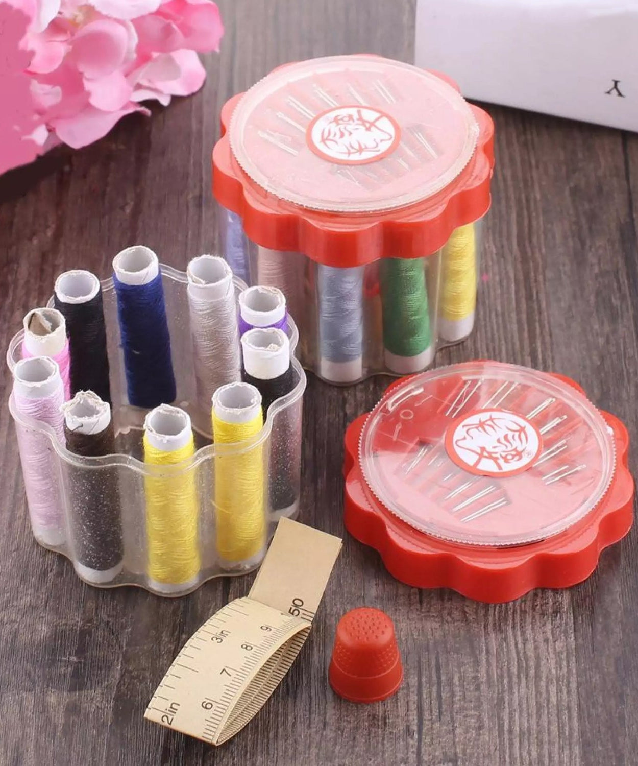 Sewing box with multiple compartments for organizing threads, needles, and sewing supplies.